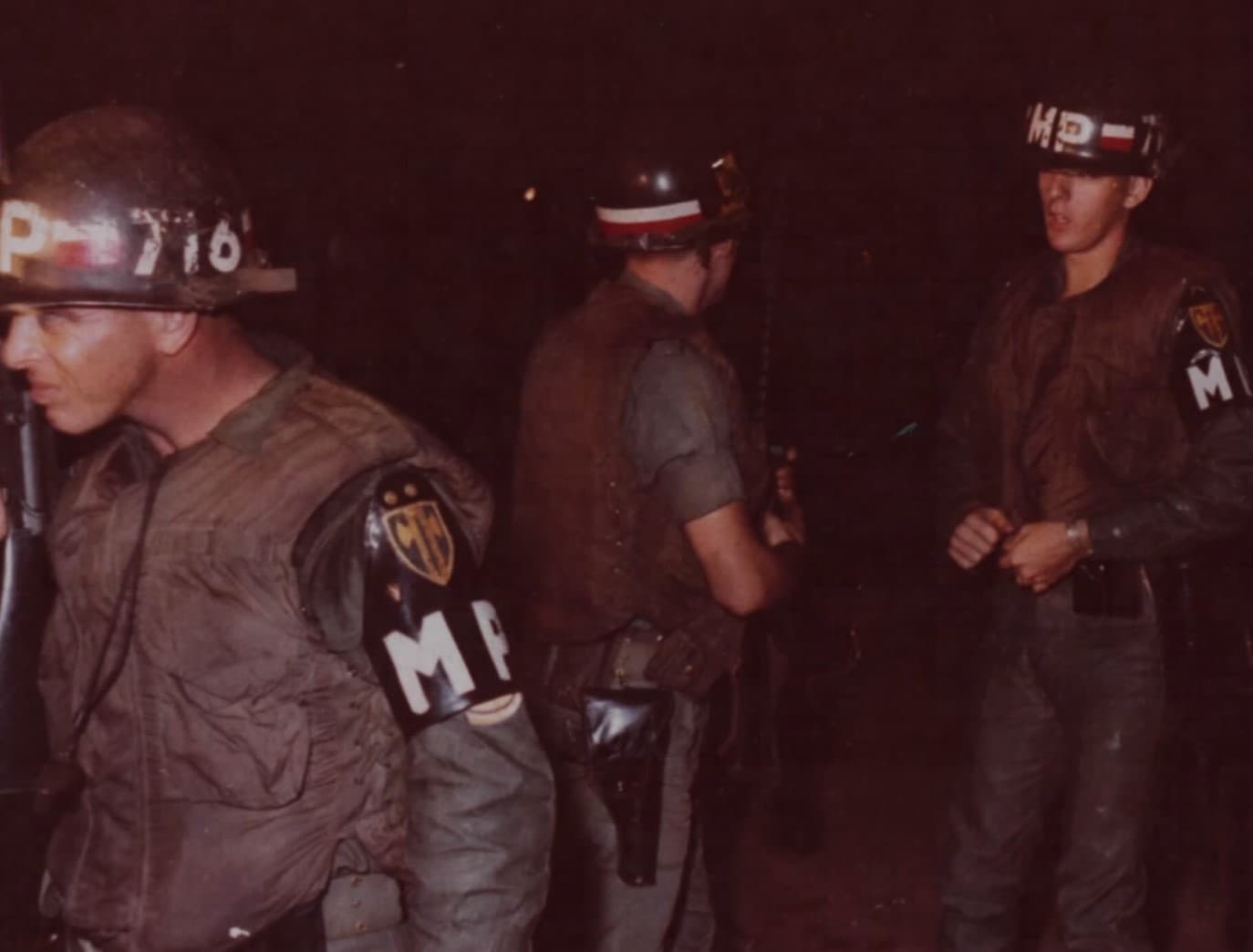 Military police conducting night disaster drill with emergency equipment and procedures training
