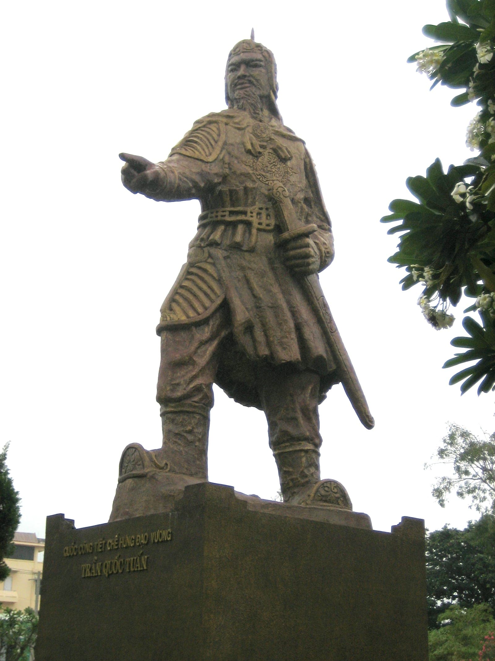 Stone statue of Tran Hung Dao in traditional robes and formal pose, commemorating Vietnam's thirteenth-century military general and national hero.