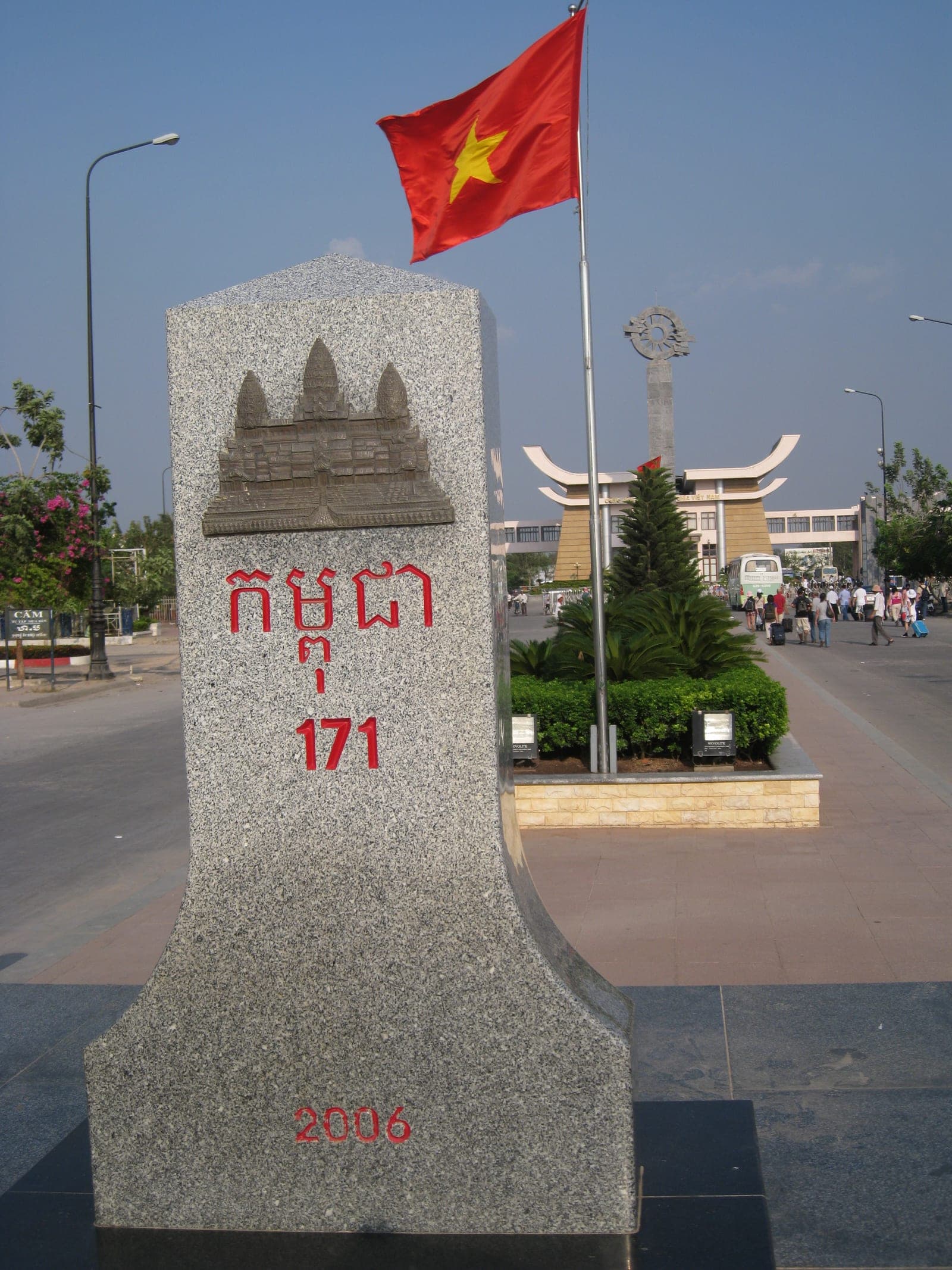 Mộc Bài border crossing checkpoint between Vietnam and Cambodia with immigration booths and travelers on the road